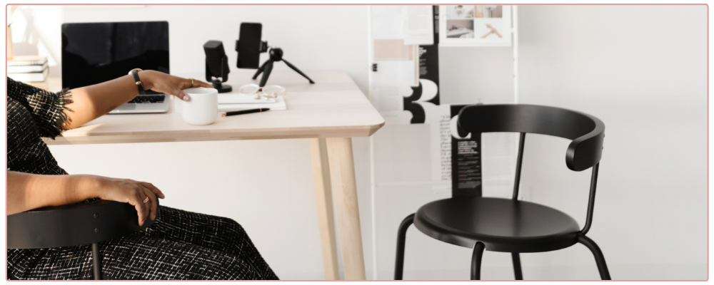 Woman's purse spilled out on desk - for 5 mistakes business owners make when setting goals blog post