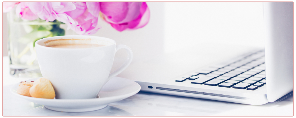Inspirational Prompts for Christmas, woman drinking hot chocolate and writing in her journal with a candy cane as decoration