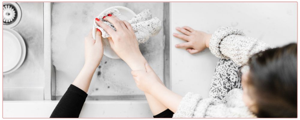 Woman at her desk feeling overwhelmed.