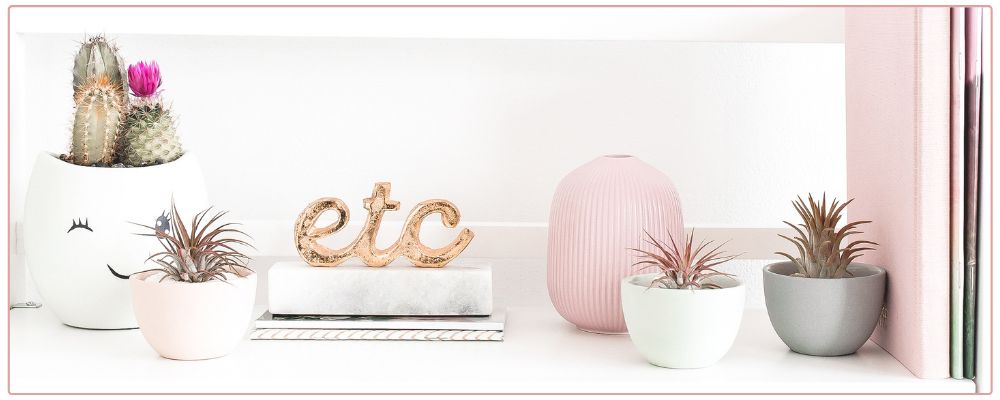 Inspirational Prompts for Christmas, woman drinking hot chocolate and writing in her journal with a candy cane as decoration